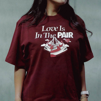 NIKE TEE LOVE IS IN THE PAIR WINE W