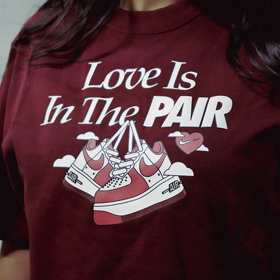 NIKE TEE LOVE IS IN THE PAIR WINE W
