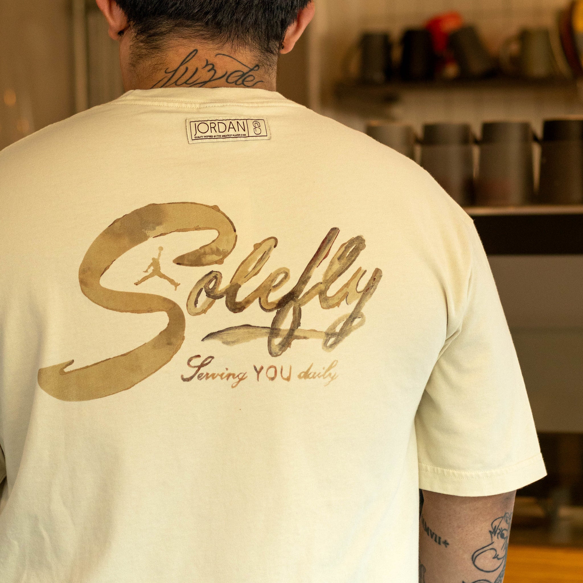 JORDAN X SOLEFLY TEE BARISTA FOSSIL