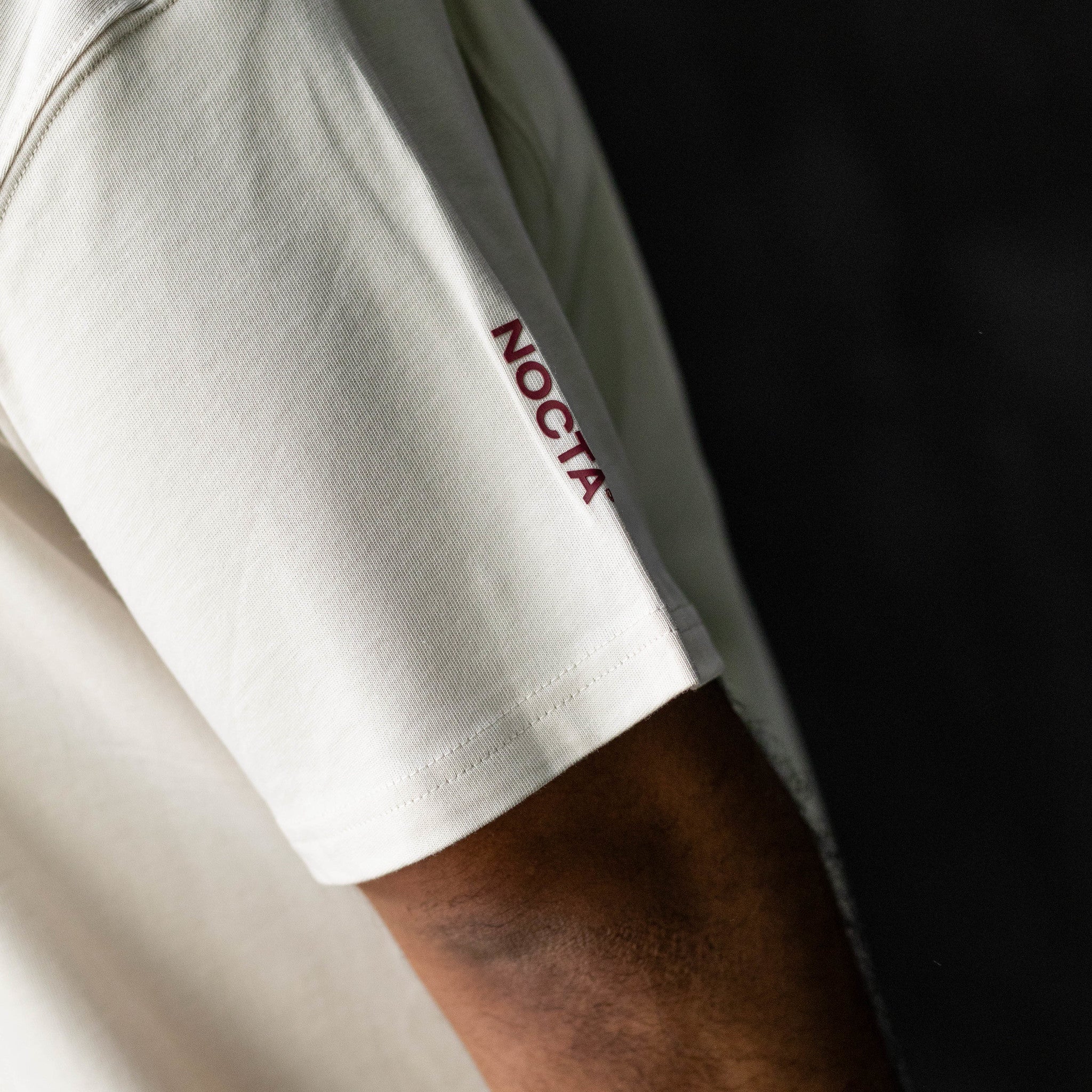 NIKE NOCTA CARDINAL TEE OREWOOD