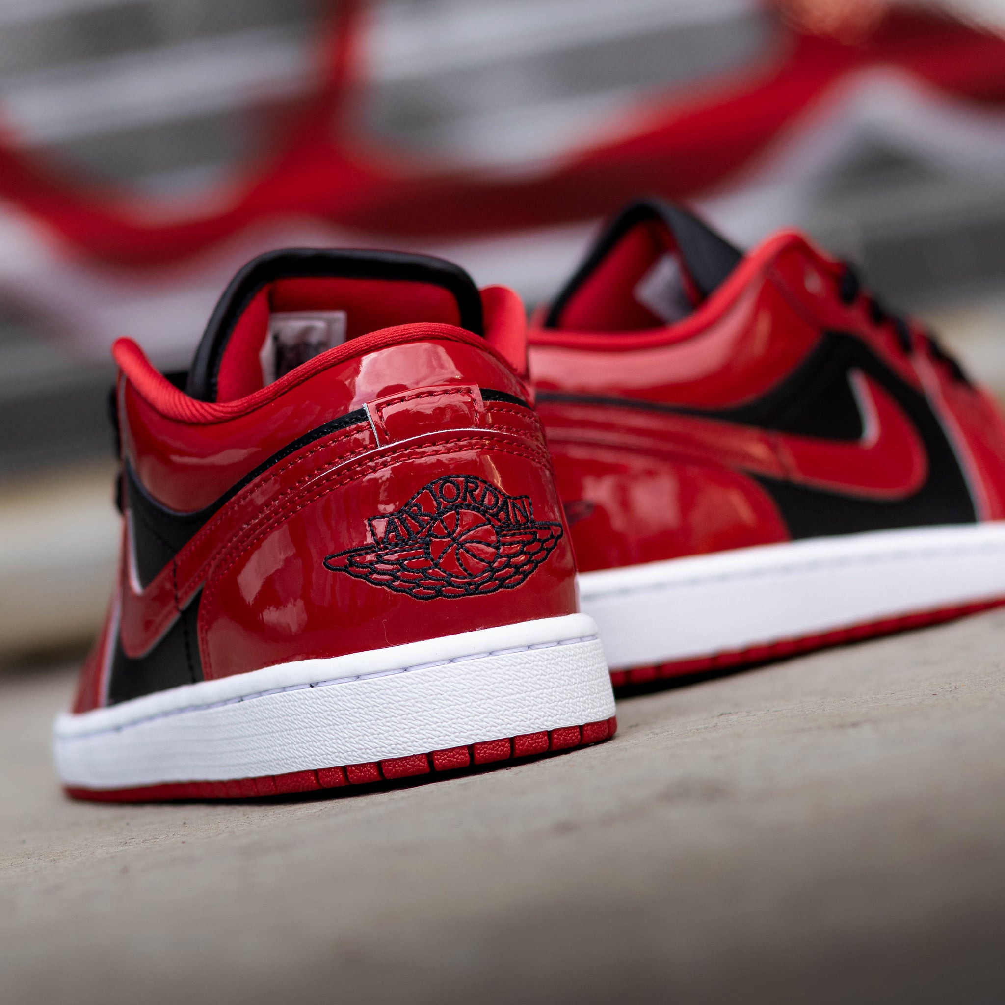 AIR JORDAN 1 LOW BLACK VARSITY RED PATENT
