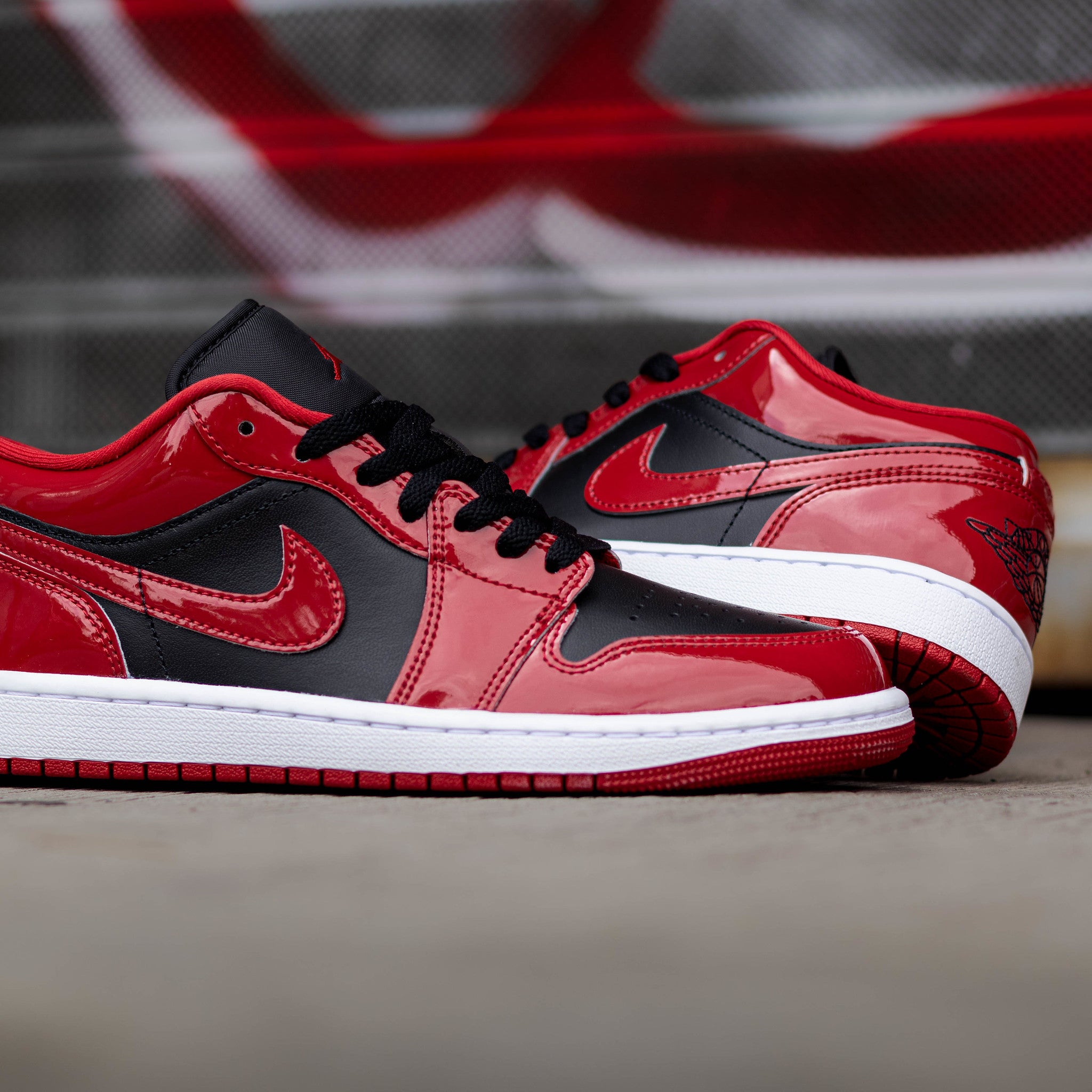 AIR JORDAN 1 LOW BLACK VARSITY RED PATENT