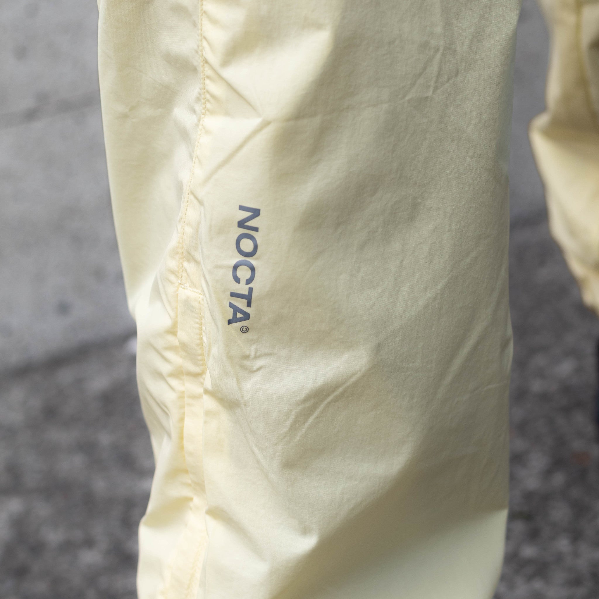 NIKE NOCTA TRACKER PANTS ALABASTER
